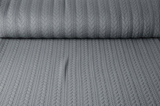 Attēls ar Trikotāžas audums ar adījuma rakstu - pelēkas pīnes 340 g/m² – pieejams Šarlotes audumi