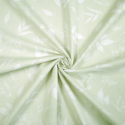 100% coton - feuilles sur fond vert tendre 125 g/m²