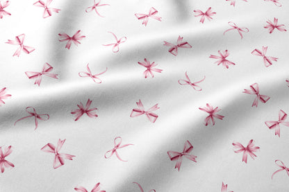 Image du tissu 100 % coton - nœuds roses – disponible en ligne chez Šarlotes audumi