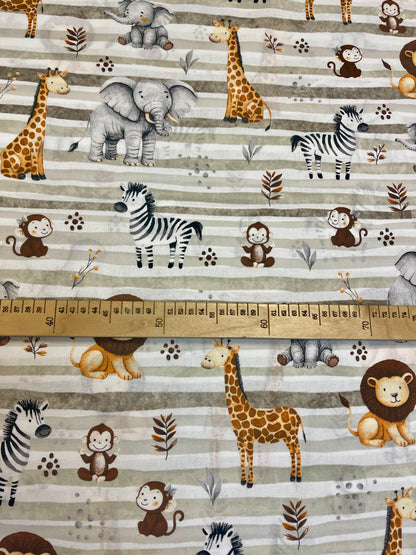 Image with 100% cotton fabric - safari animals and green stripes 125 g/m – available at Charlotte's Fabrics