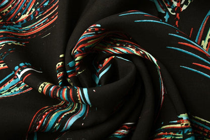 Tissu 100 % viscose - motif plumes coloré 95 g/m²