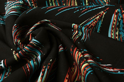 Tissu 100 % viscose - motif plumes coloré 95 g/m²
