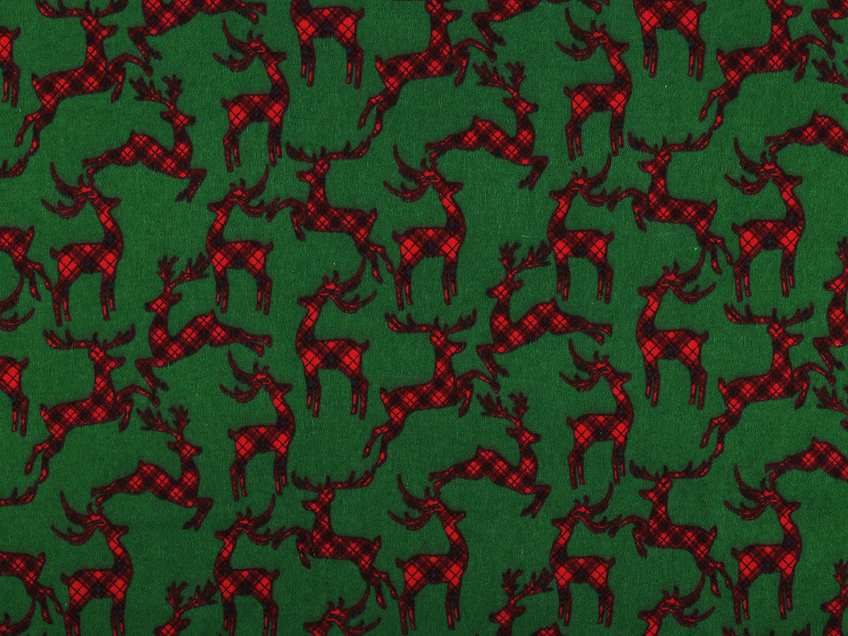 Weihnachtlicher Baumwollflanell mit Rentieren auf grünem Grund