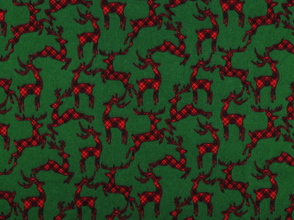 Weihnachtlicher Baumwollflanell mit Rentieren auf grünem Grund
