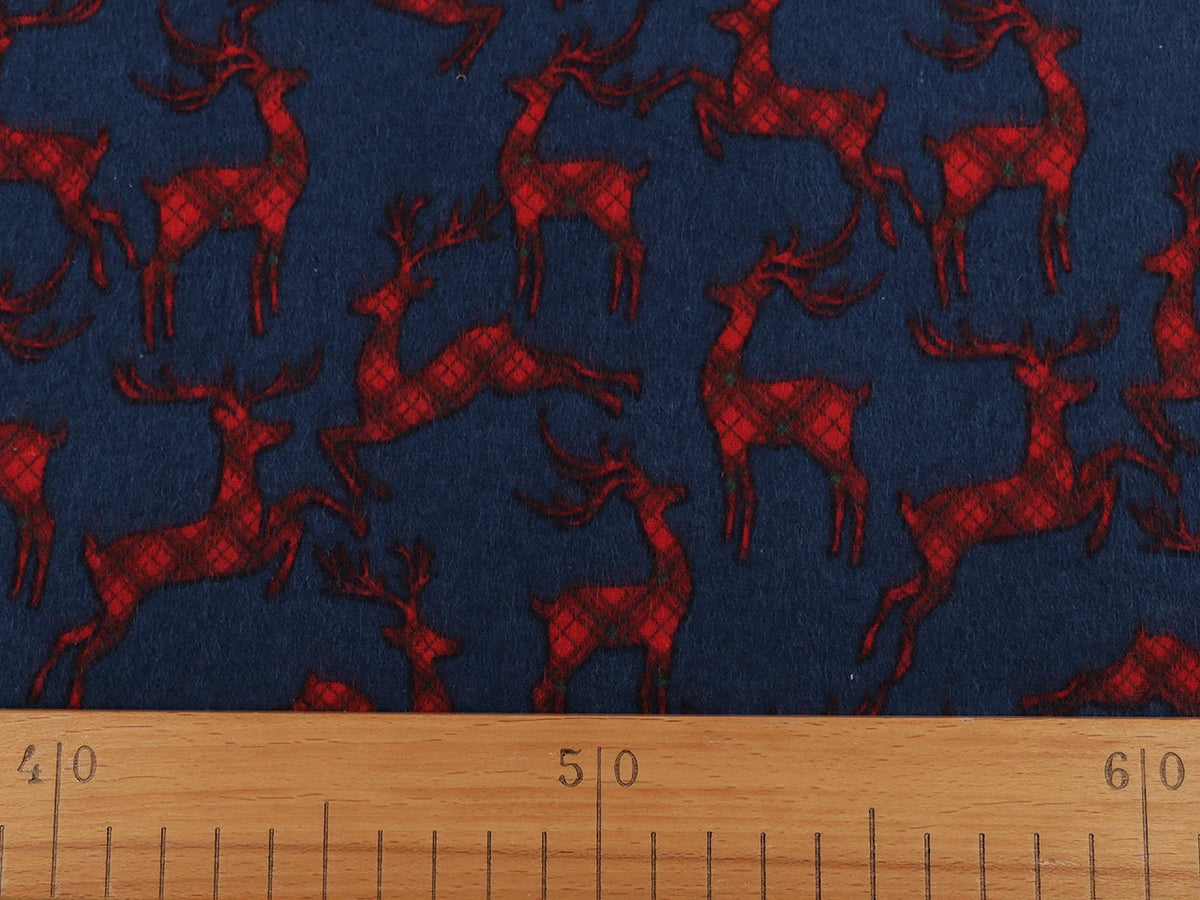 Weihnachts-Baumwollflanell mit Rentieren auf Blau