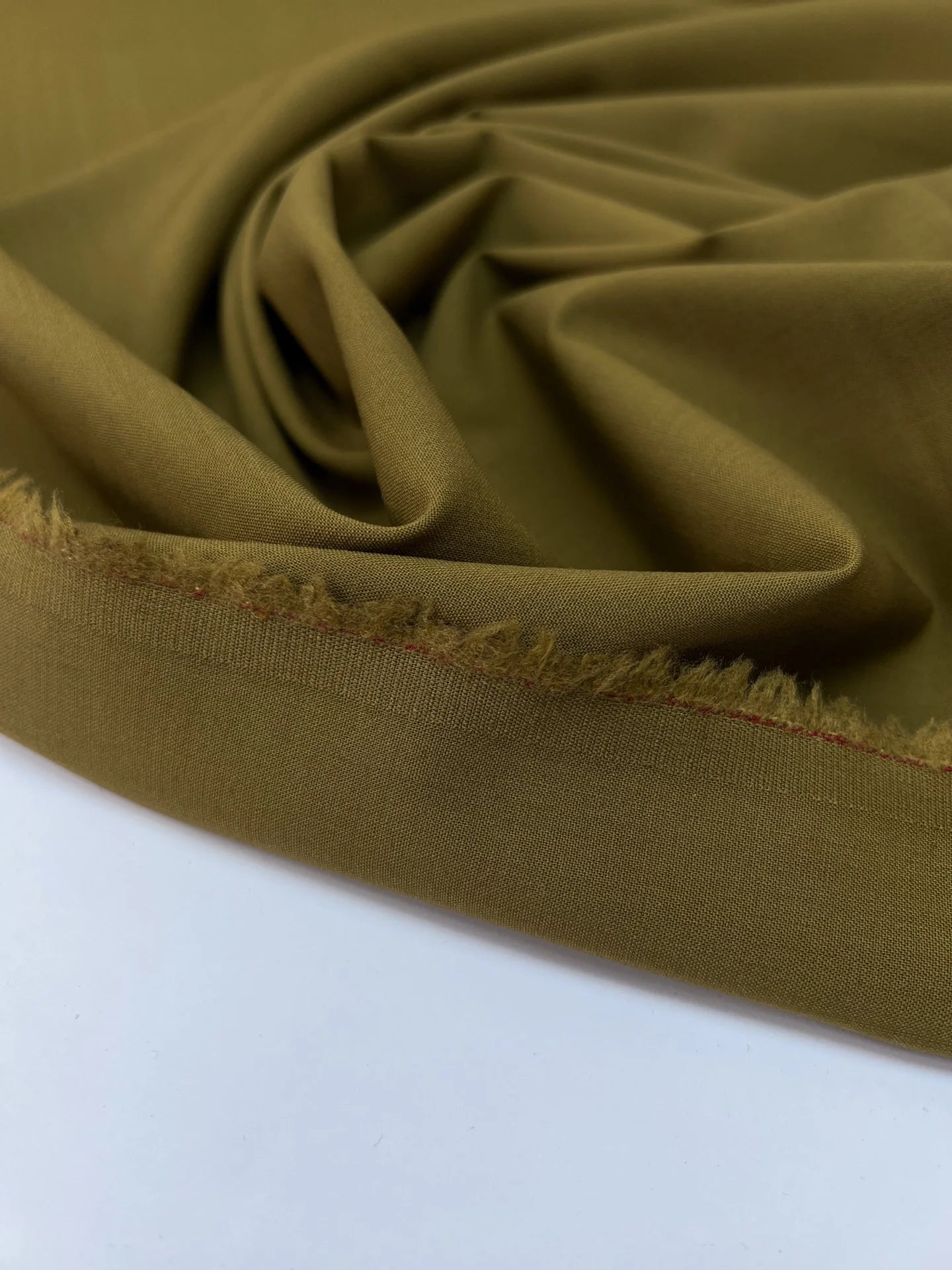 Tissu en laine avec élasthanne, couleur vert brun – France