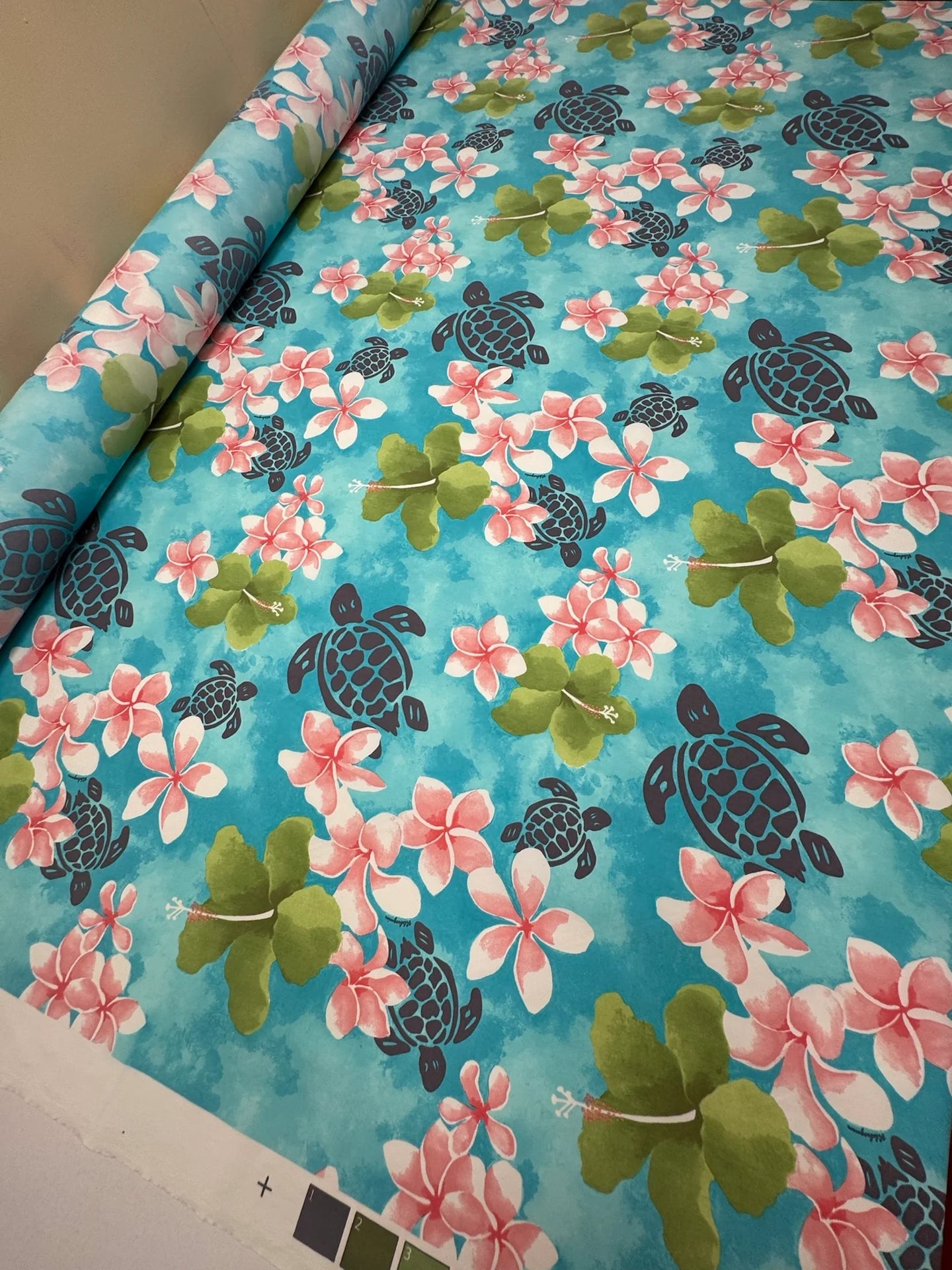 French fabric with a tropical floral pattern in teal tones – available online at Charlotte's Fabrics