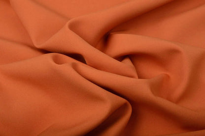 Gabardine orange – disponible en ligne chez Šarlotes audumi