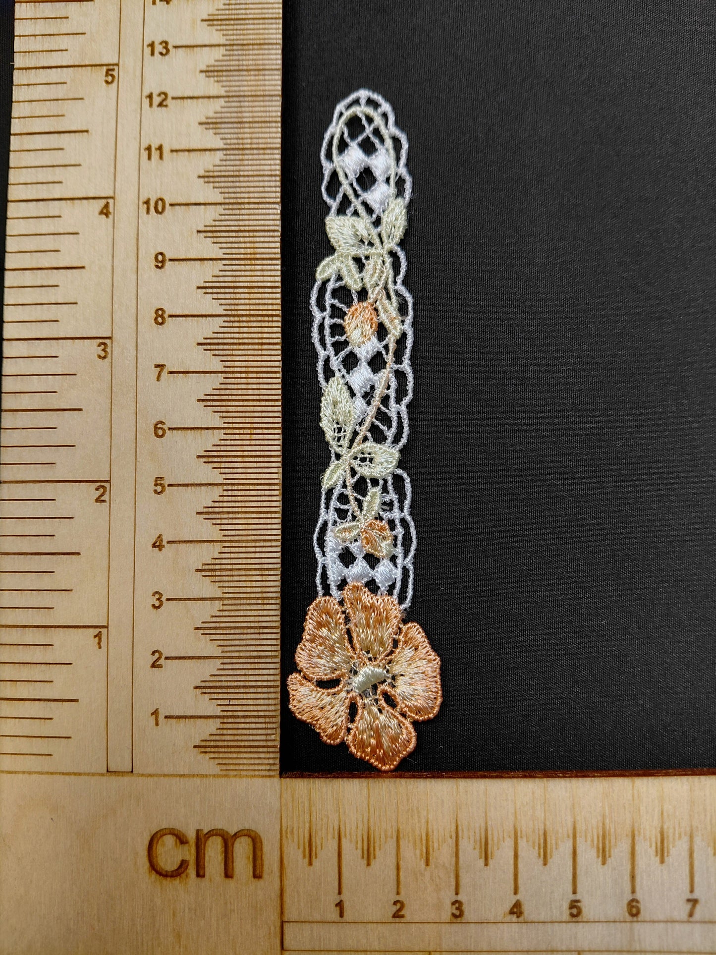 Image of patch/embroidered applique 12 x 2,5 cm – available at Šarlotes audumi