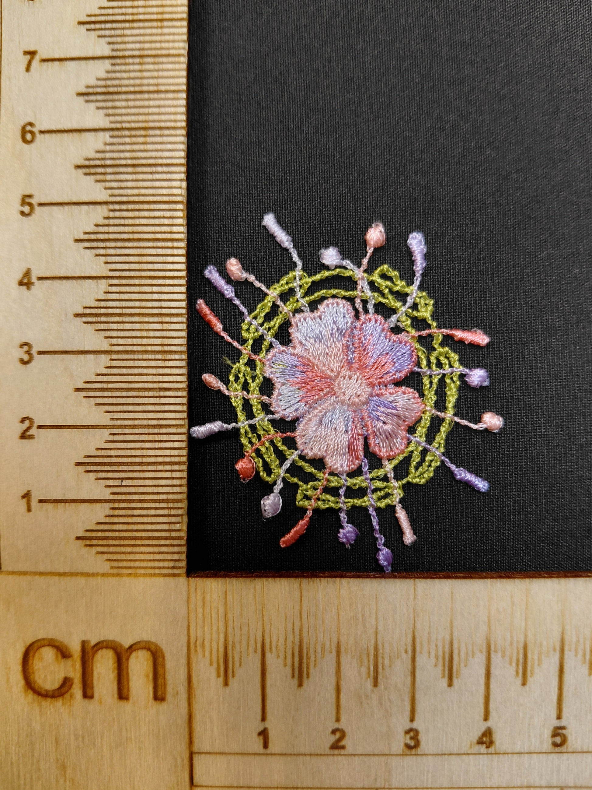 Image with patch/embroidery 3 x 3 cm – available at Šarlotes audumi