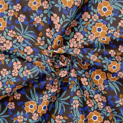 Popeline mit blauen und orangefarbenen Blumen