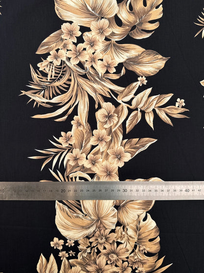 Image of Italian cotton fabric with a tropical floral pattern on a black background – available online Šarlotes audumi
