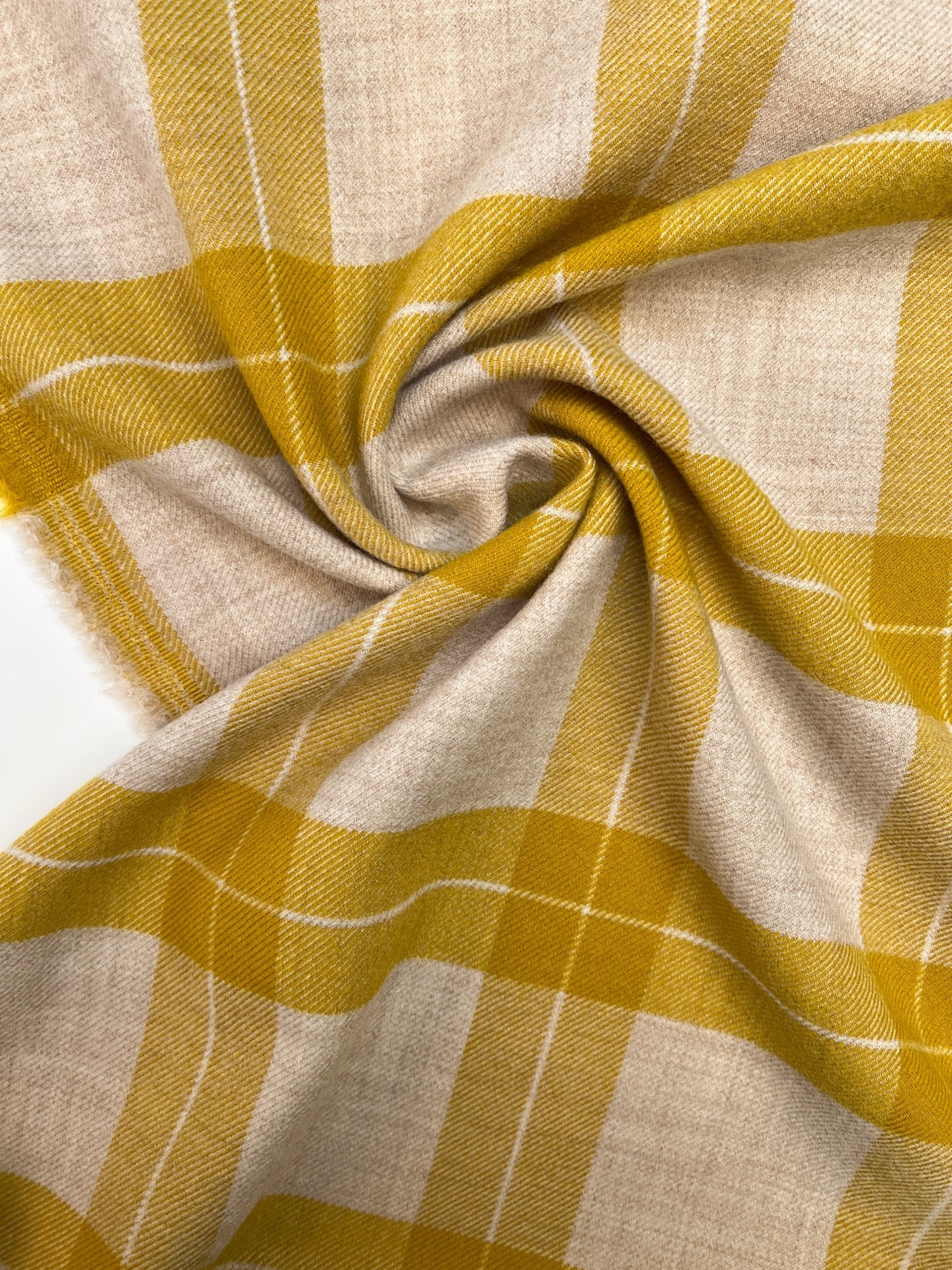 Image of Italian wool and alpaca fabric in a checkered pattern in mustard yellow tones – available online at Šarlotes audumi
