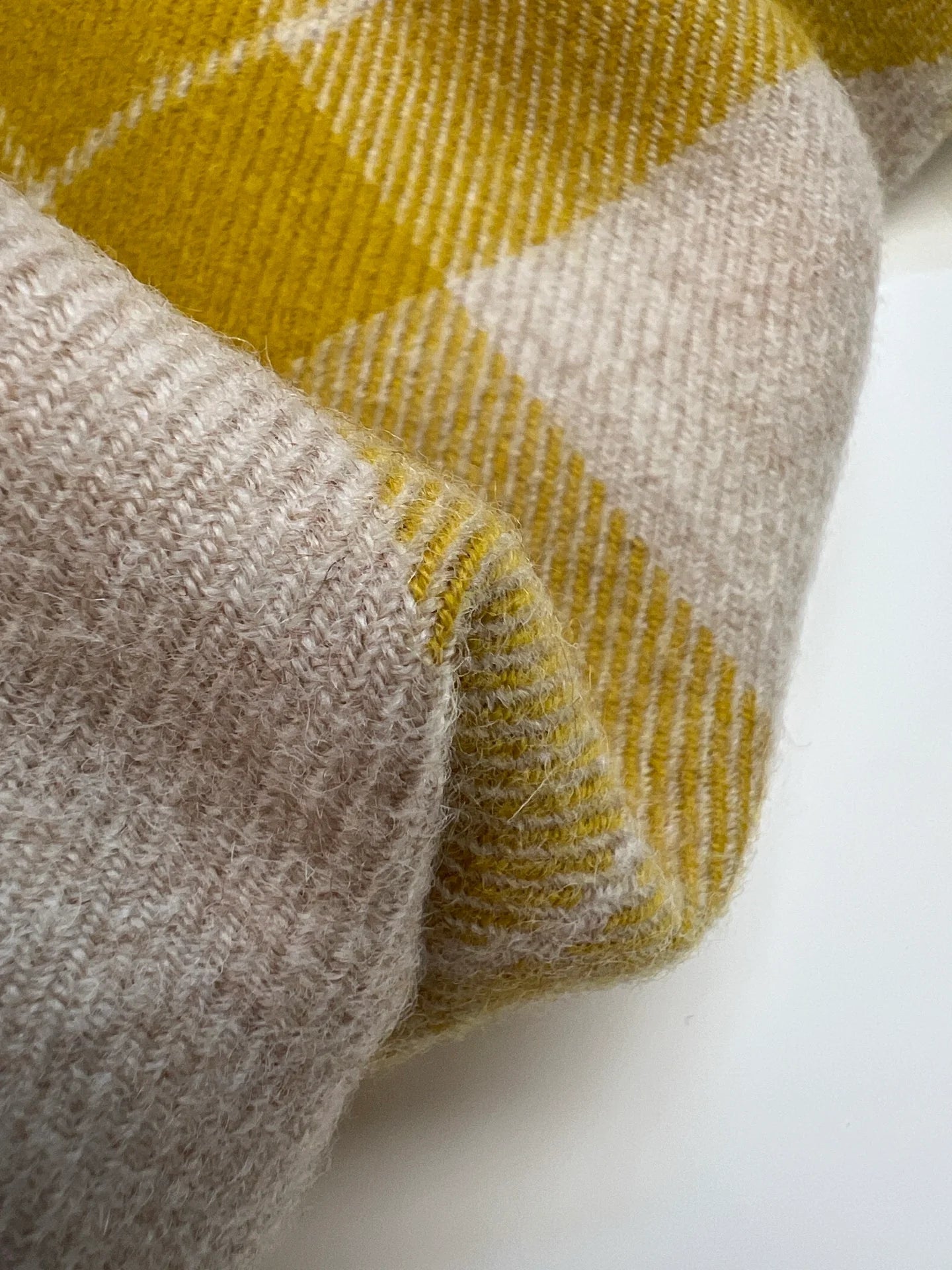 Image of Italian wool and alpaca fabric in a plaid pattern in mustard yellow tones – available online at Charlotte's Fabrics
