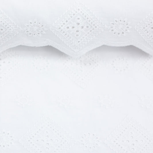 Image of embroidered cotton fabric with diamond and floral motif in white, 150 g/m² – available online at Šarlotes audumi