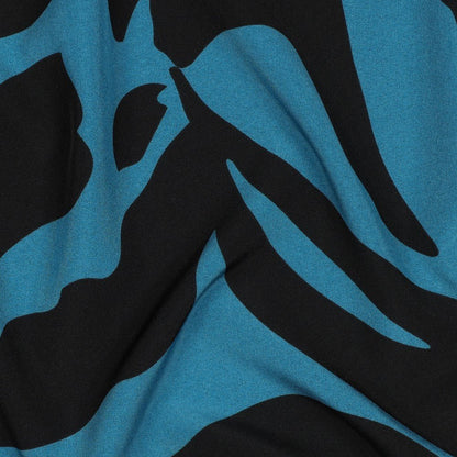 Tissu pour robe avec élasthanne, motif moucheté sur fond pétrole, 80 g/m² – disponible chez Tissus de Charlotte