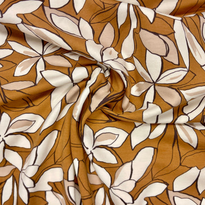 Maille bouclette en coton - fleurs sur fond marron 225 g/m²