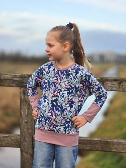 Jersey en coton - feuilles sur fond bleu 200 g/m²