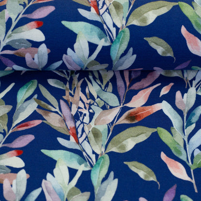 Jersey en coton - feuilles sur fond bleu 200 g/m²