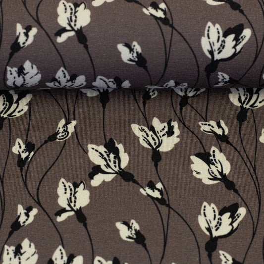 Attēls mit Baumwoll-Jersey-Blumenmuster auf graubraunem Hintergrund 210 g/m² – online erhältlich bei Šarlotes audumi