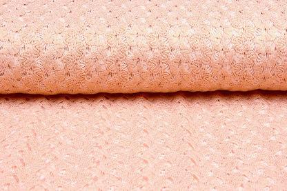 Tissu en dentelle - rose pêche avec accents dorés 170 g/m²