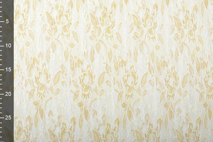 Fine lace fabric with gold - black 90 g/m²