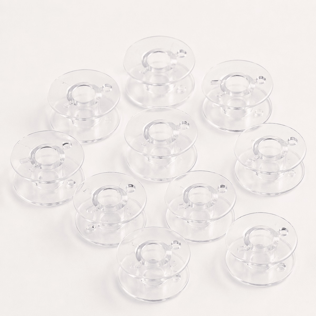 Bild mit Kunststoffspule, flach, für Nähmaschinen, Ø 20,4 mm – Set mit 10 Stk. – online erhältlich bei Šarlotes audumi