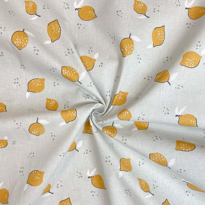 Tissu premium 100 % coton - citrons sur fond gris clair 115 g/m²