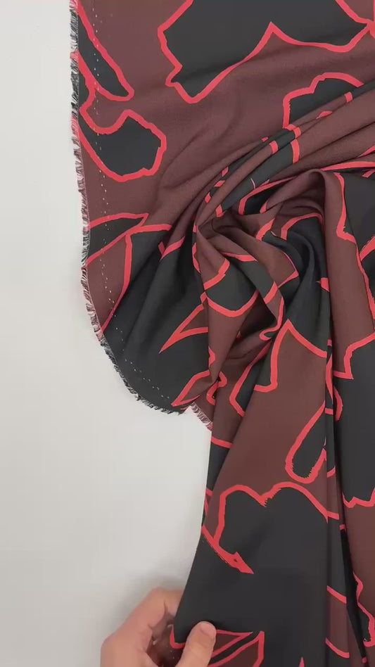 Italiana stretch fabric with abstract pattern | Polyester 98% Elastane 2% | 148 cm | Brown & Black | Small defect
