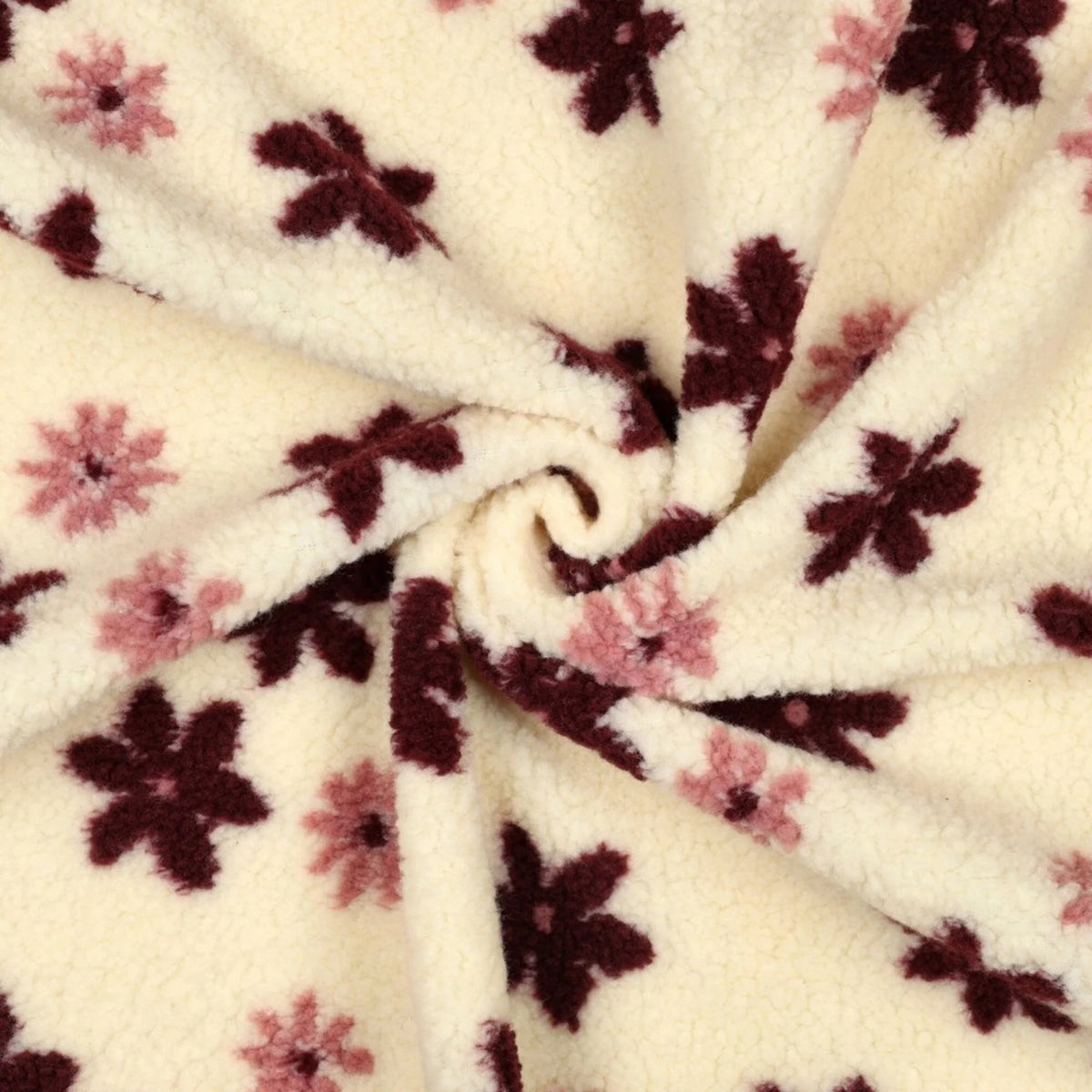 Attēls mit Teddy-Fleece-Blumen auf hellem Hintergrund – online bei Šarlotes audumi erhältlich