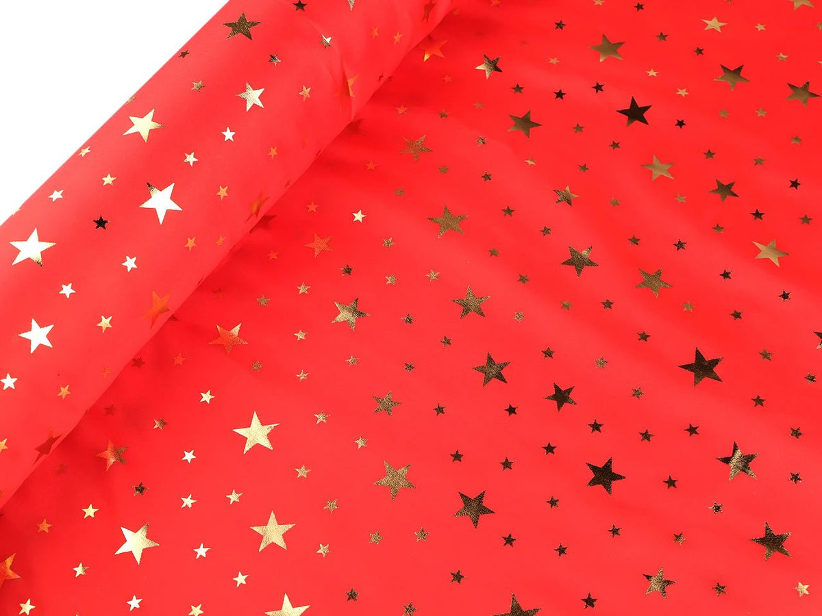 Bild eines dekorativen Weihnachtsstoffs mit goldenen Sternen – online erhältlich bei Šarlotes audumi