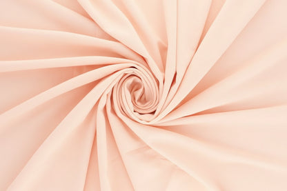 Tissu 100 % coton rose pêche 125 g/m²