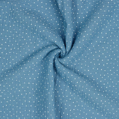 Polka dot muslin on a blue background 125 g/m²